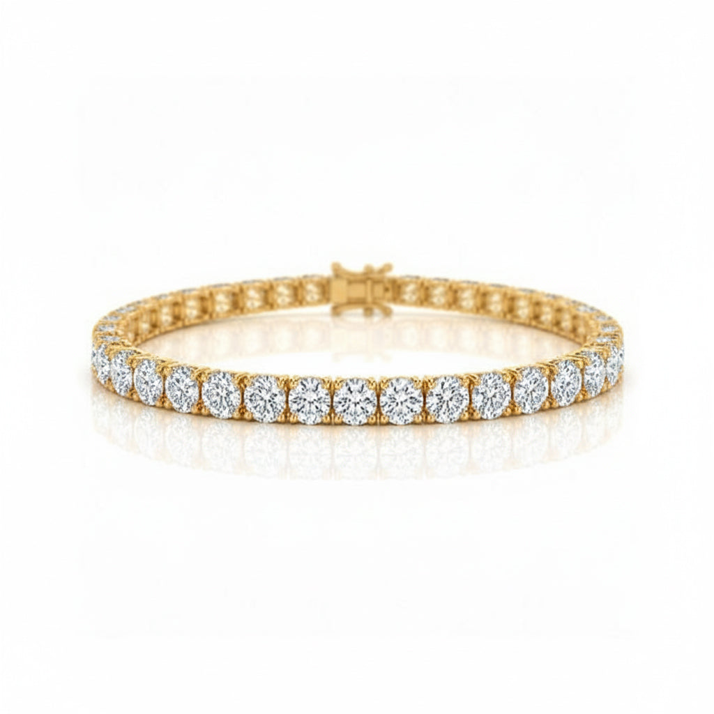 A yellow gold tennis bracelet featuring a continuous row of round-cut clear gemstones in a prong setting, displayed on a clean white background with a soft reflection.