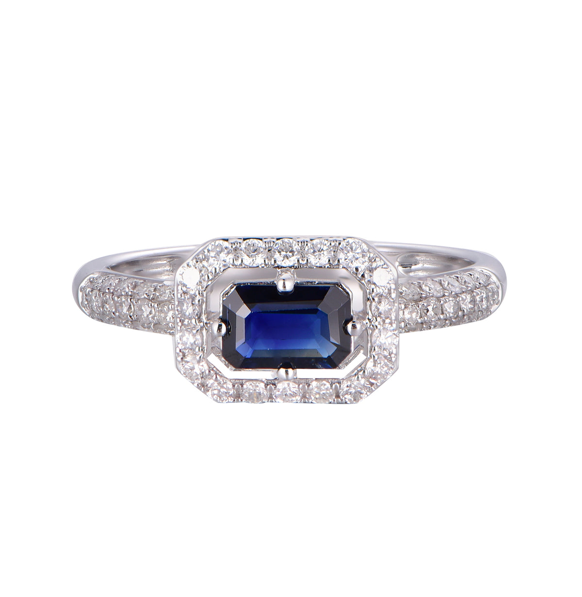14K white gold ring featuring an emerald-cut blue sapphire surrounded by a diamond halo with diamond-set shoulders