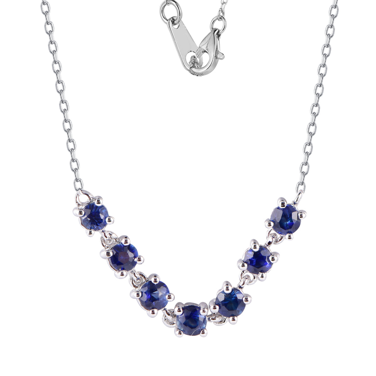 14K white gold necklace featuring a curved row of round blue sapphires suspended along a delicate chain.